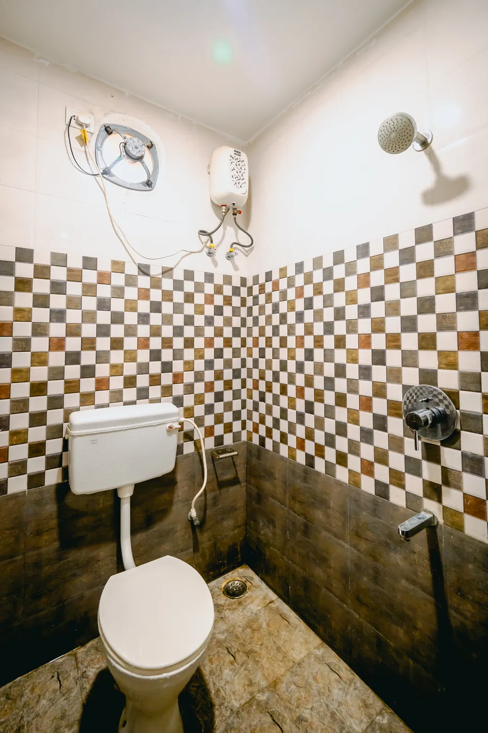 Attached private bathroom with shower and geyser at Hotel Laughing Buddha 2