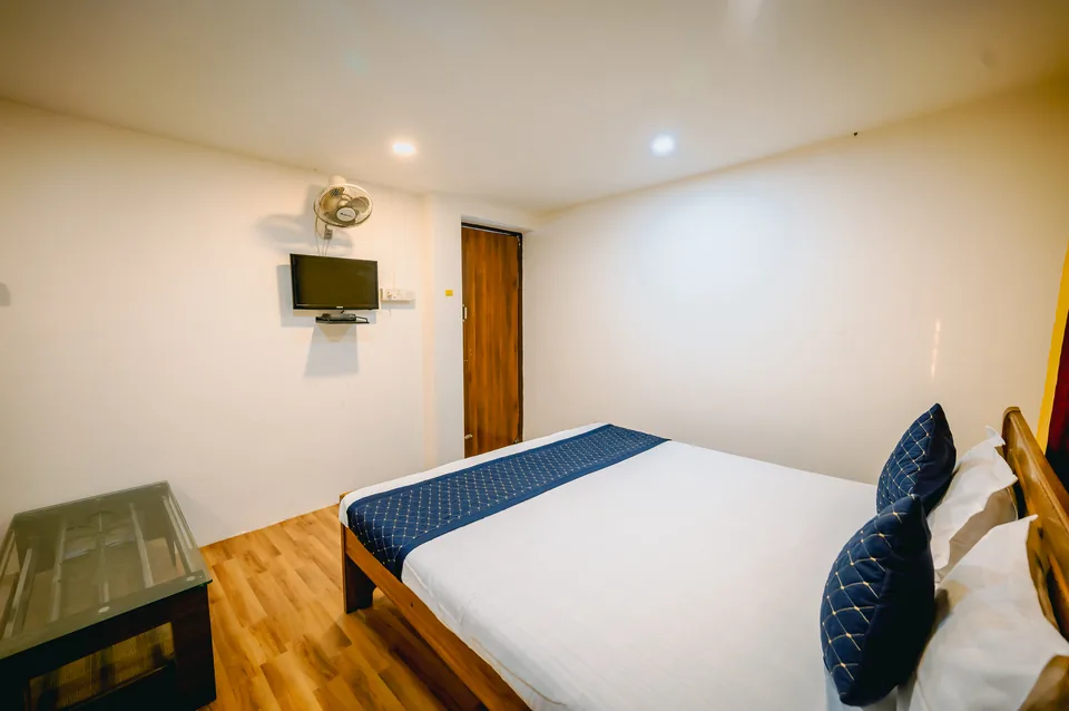 Standard AC Room additional view with glass-top table