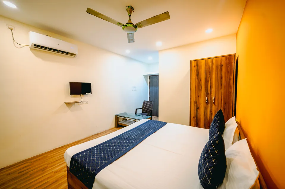 Standard AC Room showing LED TV, air conditioner and work desk